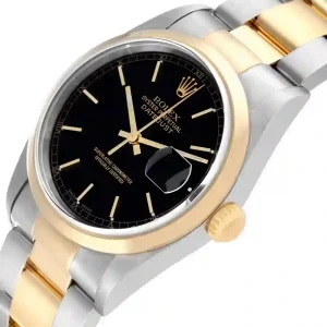 Yellow gold bezel of the watch