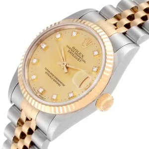 Yellow gold bezel of the watch